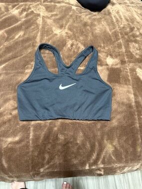 Woman’s size medium Nike Black Racerback Sports Bra with White Swoosh